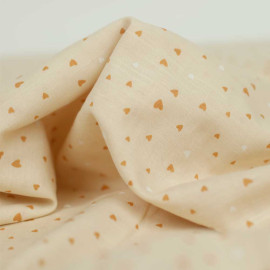 Tissu coton viscose beige à motif jolis coeur ocre et blanc